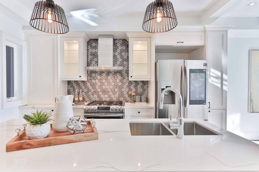 a kitchen with a sink, stove, and refrigerator